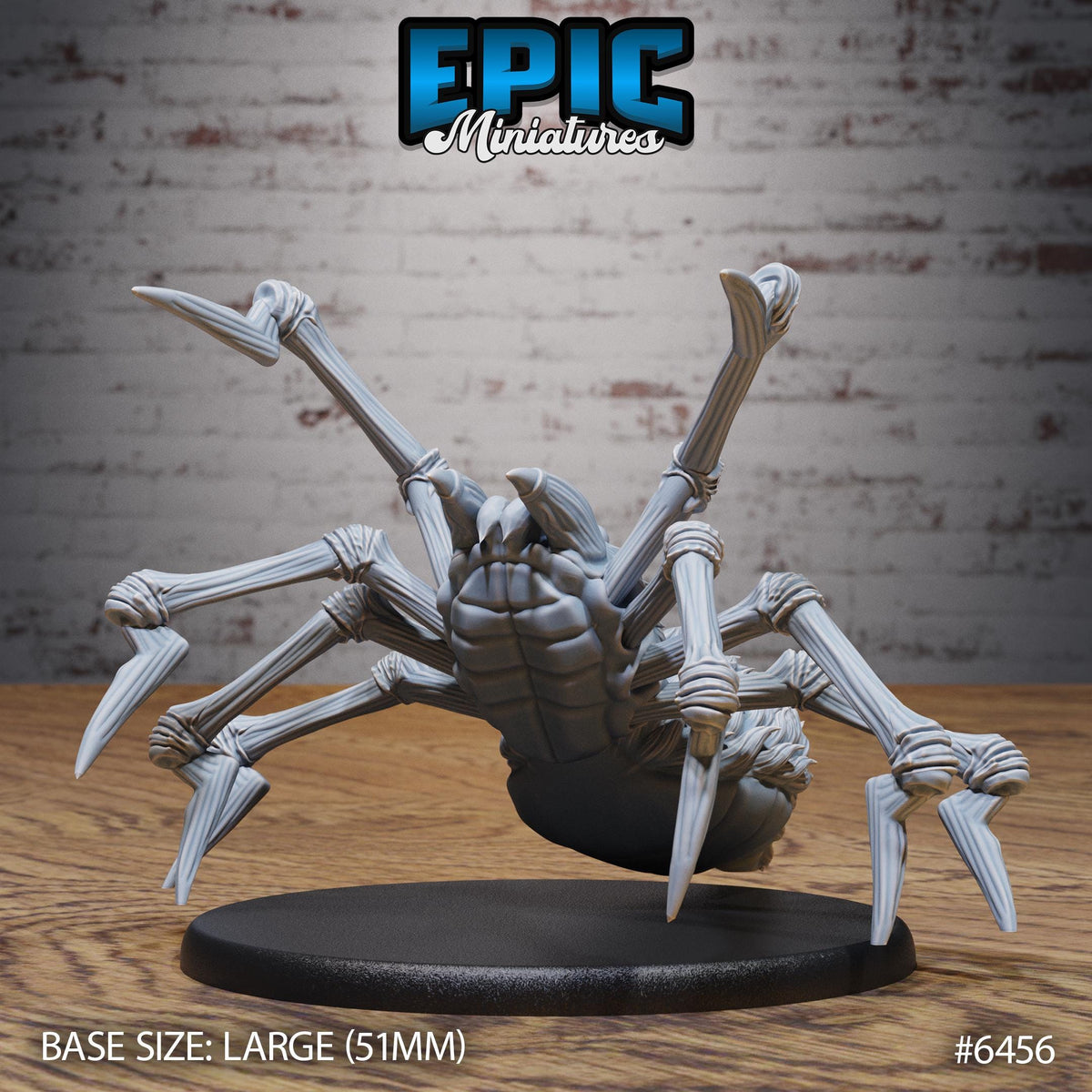 A large, detailed model of a spider with eight legs and a body, displayed on a black base.