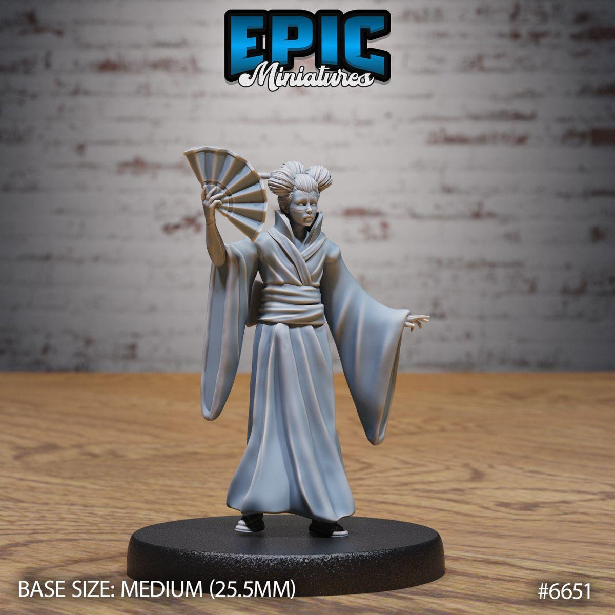 A figurine of a person in a traditional Japanese outfit, holding a fan, is displayed on a black base.