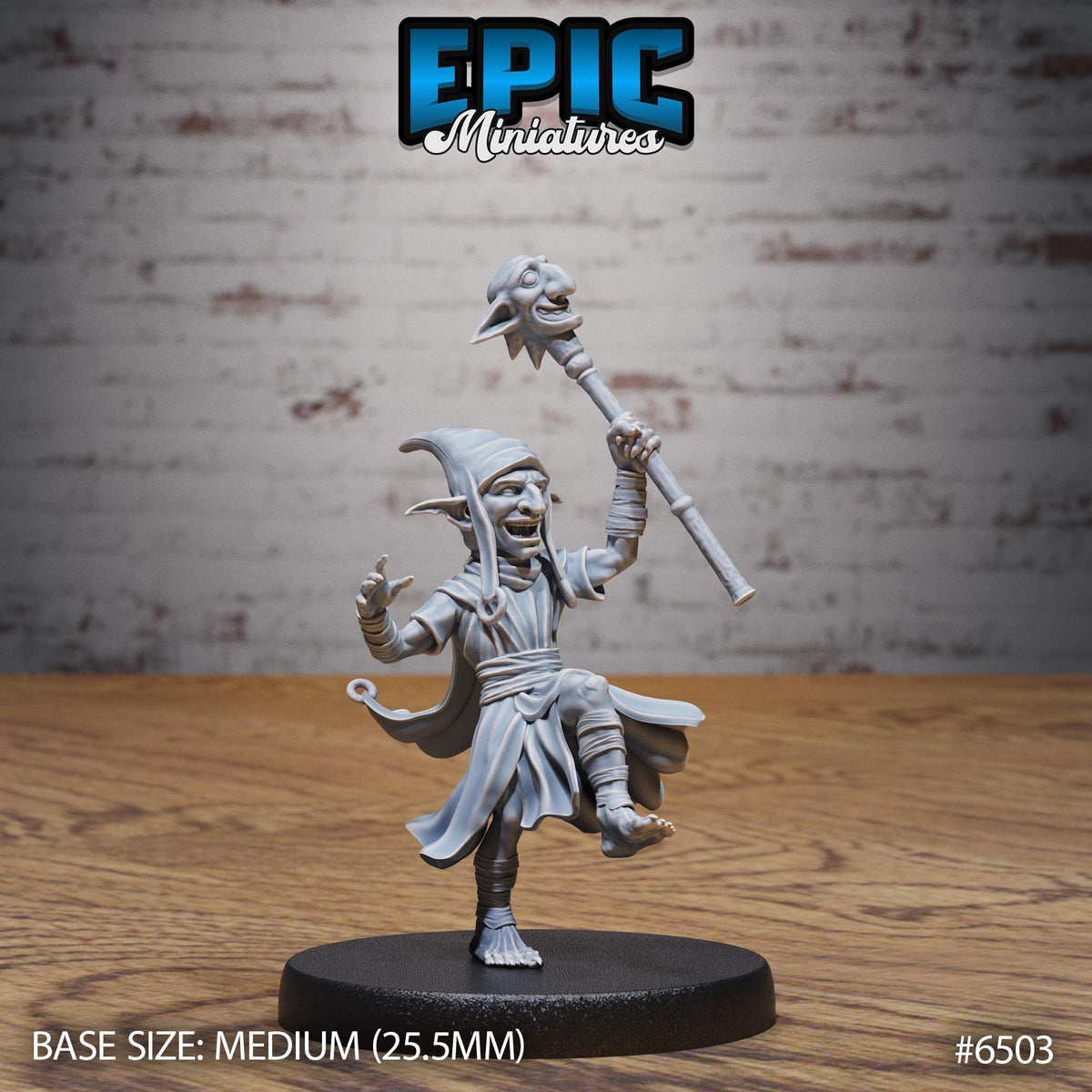 A figurine of a character with a staff and a pointed hat, standing on a black base.