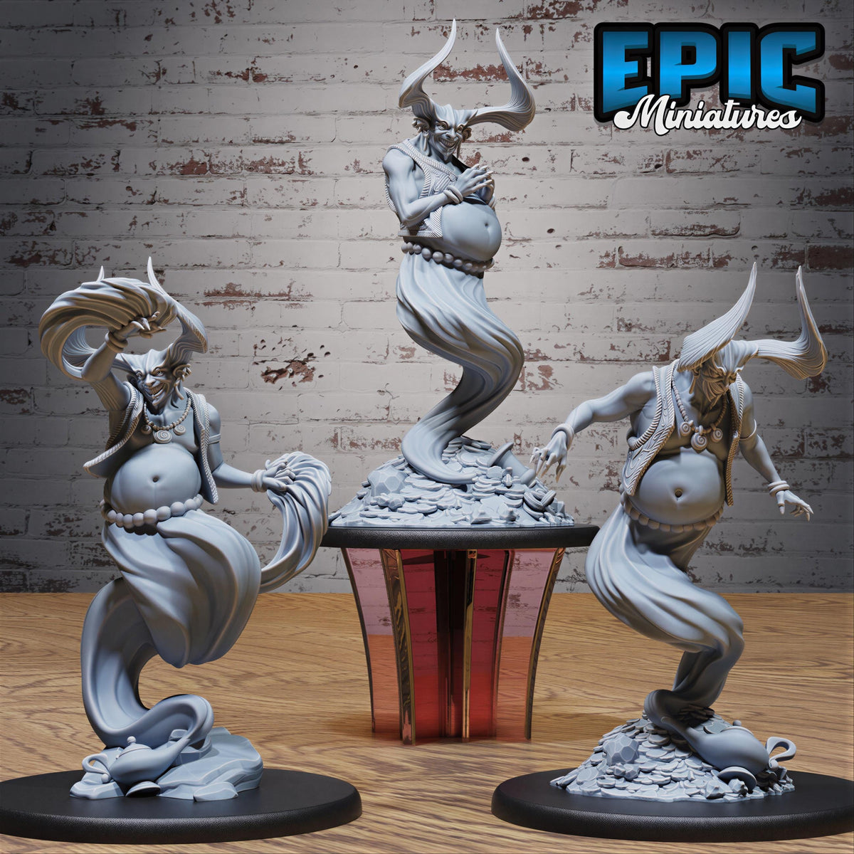 three statues of fantastical creatures, including a large, horned figure and two smaller, winged figures, all displayed on a wooden surface against a brick wall background.