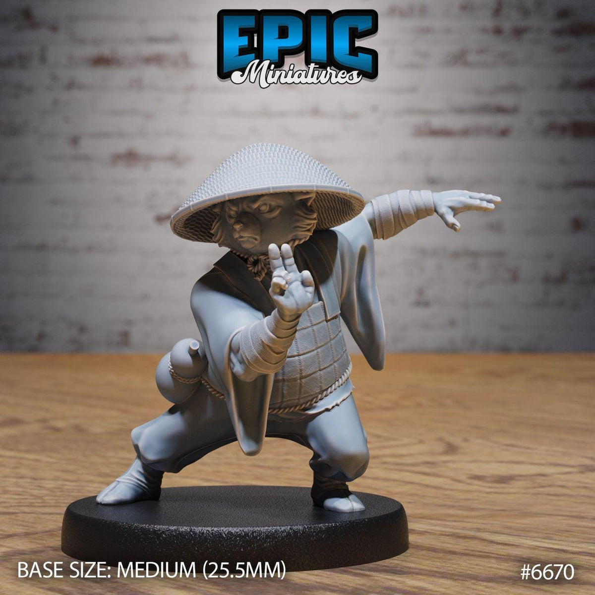 A figurine of a cat in a fighting stance, wearing a traditional Japanese outfit, is displayed on a black base.