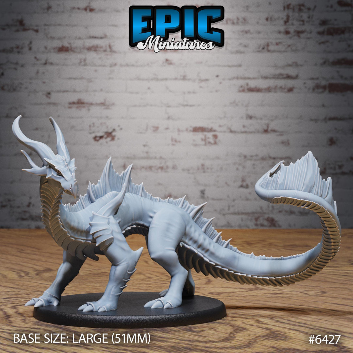 A large white dragon figurine is displayed on a black base, set against a brick wall background.
