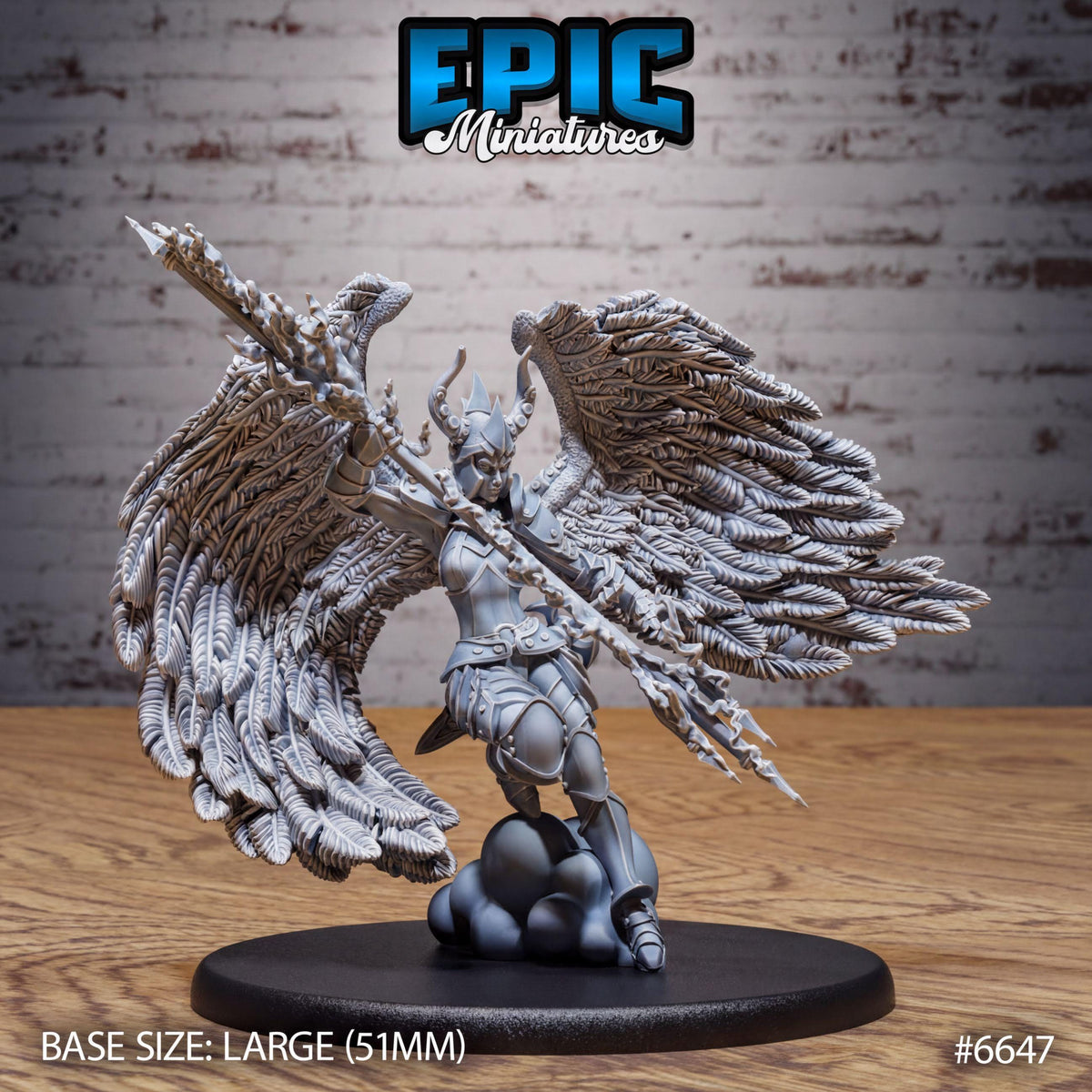 A large figurine of a winged warrior with a sword and shield, displayed on a black base.
