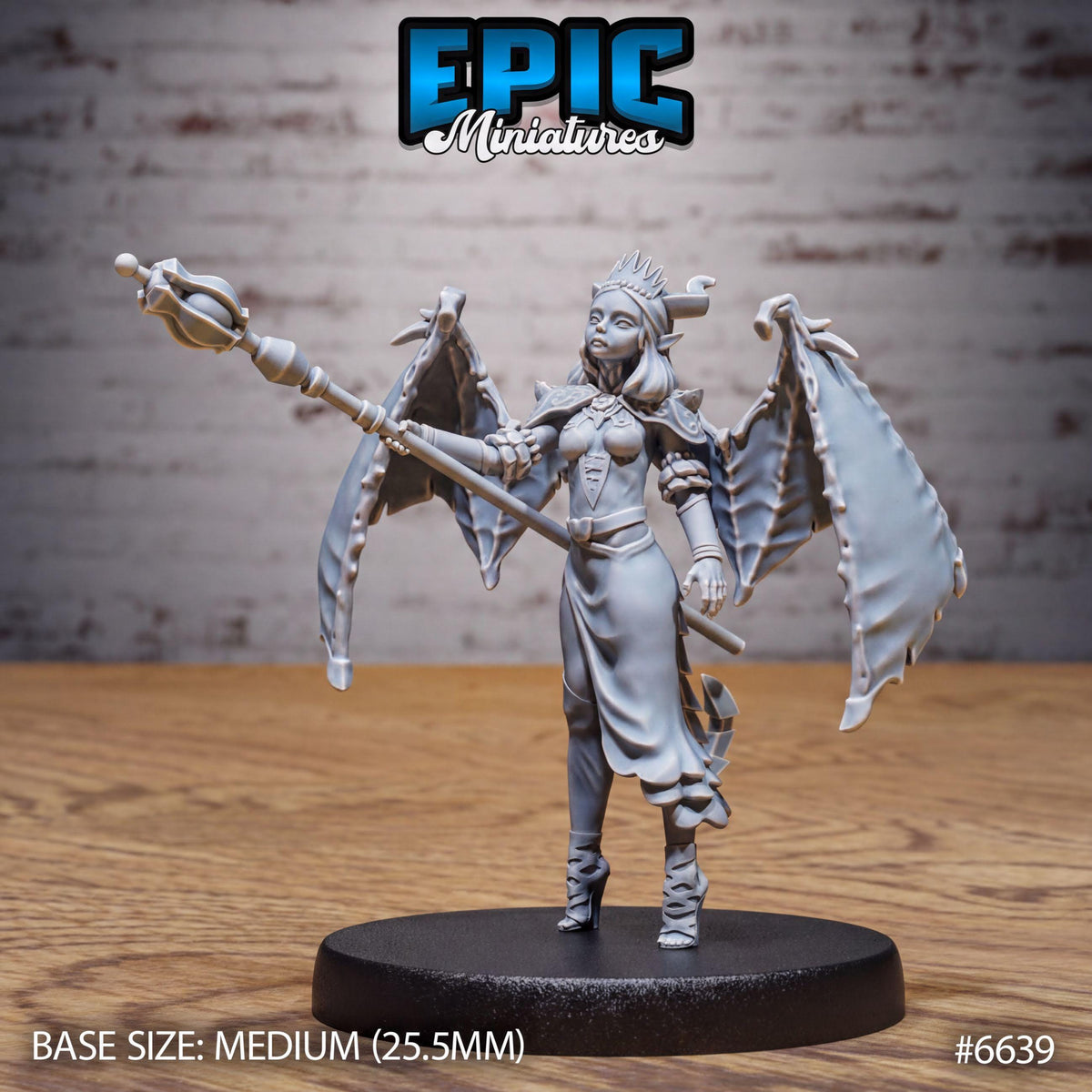 A figurine of a winged female character with a staff, standing on a black base.