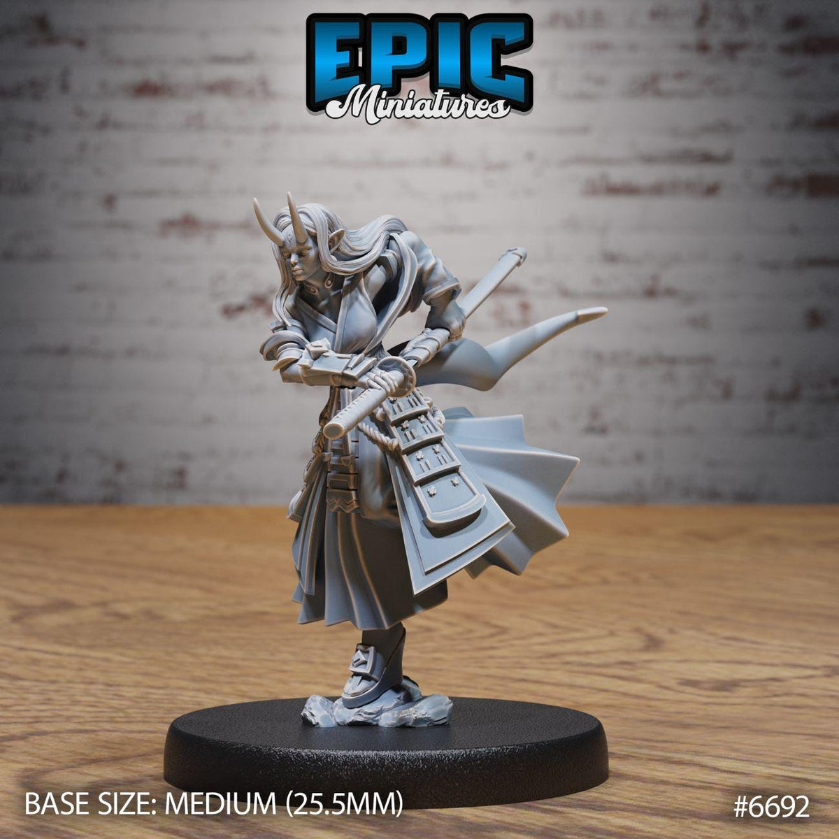 A figurine of a female character with a sword and a flowing robe, standing on a black base.