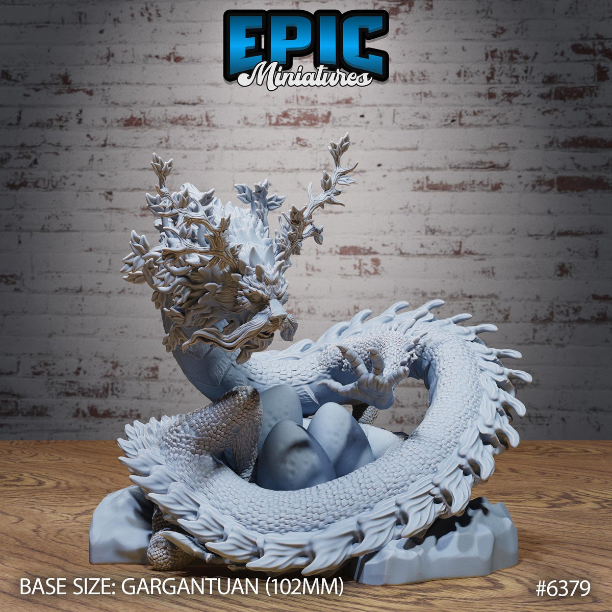 a detailed sculpture of a dragon-like creature with intricate scales and a flowing, curled body. The sculpture is displayed on a wooden surface against a brick wall background.