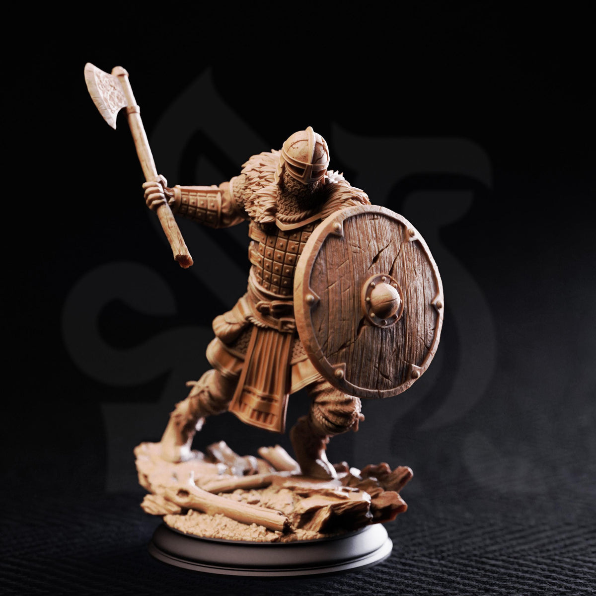 A detailed figurine of a warrior wielding a sword and shield, standing on a rocky base against a dark background.