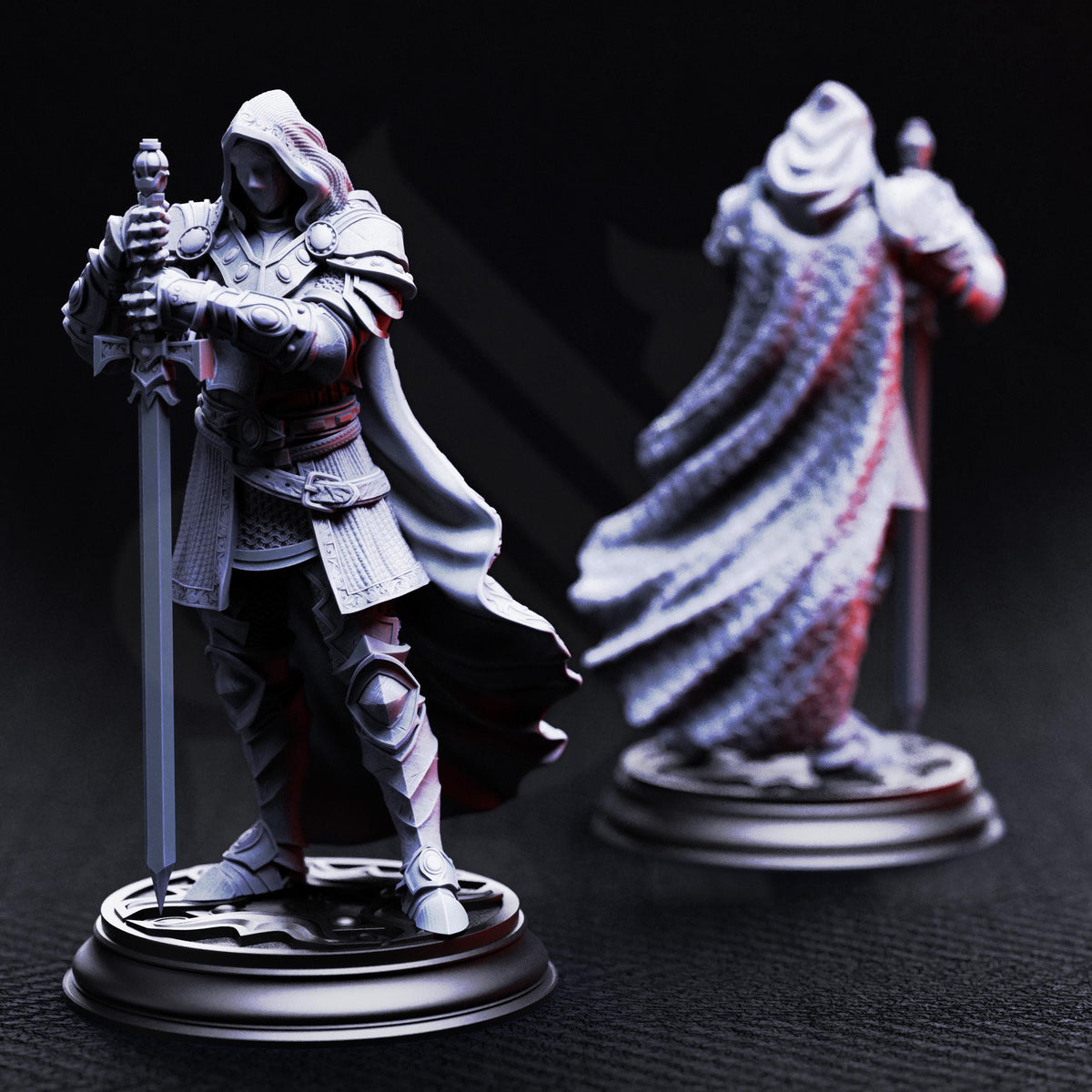 two figurines of knights, one standing and one kneeling, both holding swords and wearing armor.
