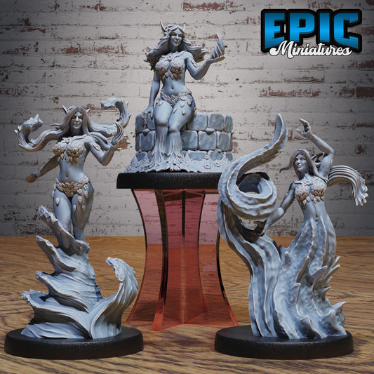 three figurines of women, each with unique poses and expressions, displayed on a stand against a brick wall background.