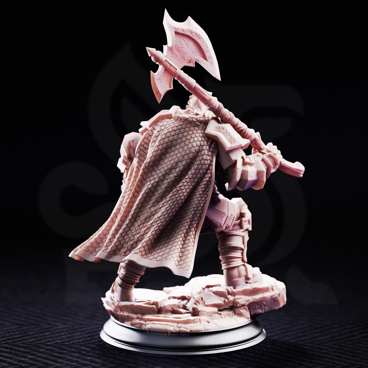 A figurine of a knight in armor, holding a sword and shield, standing on a rocky base against a dark background.