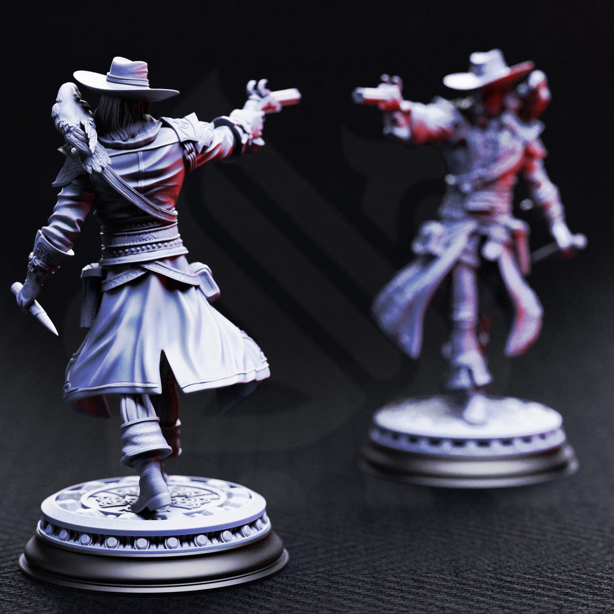 two figurines of a cowboy, one standing and one kneeling, both holding guns and wearing hats.