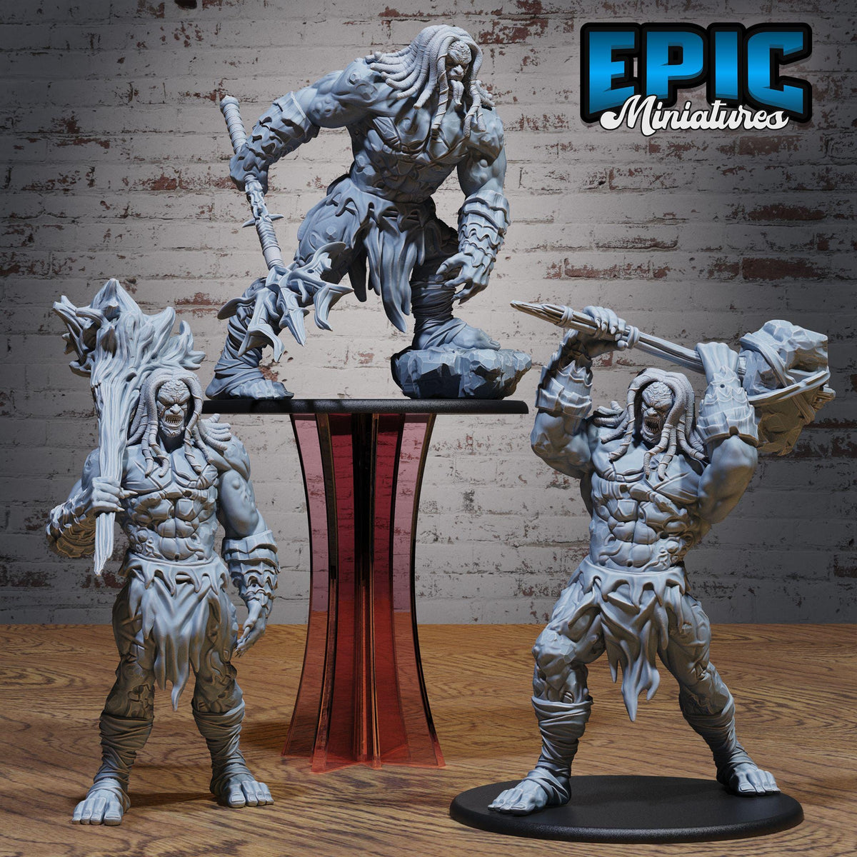 three detailed figurines of fierce-looking, muscular fantasy creatures, likely representing characters from a fantasy video game or tabletop role-playing game.