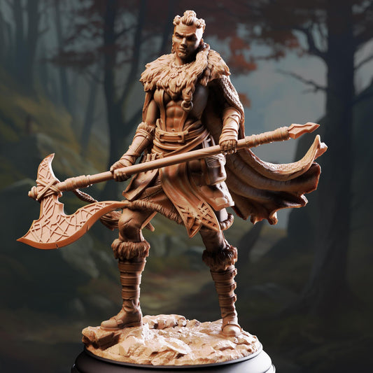 A bronze statue of a warrior figure holding a large weapon and standing in a forest setting.