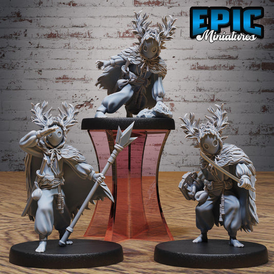 three figurines of characters from a video game, each with unique poses and accessories.