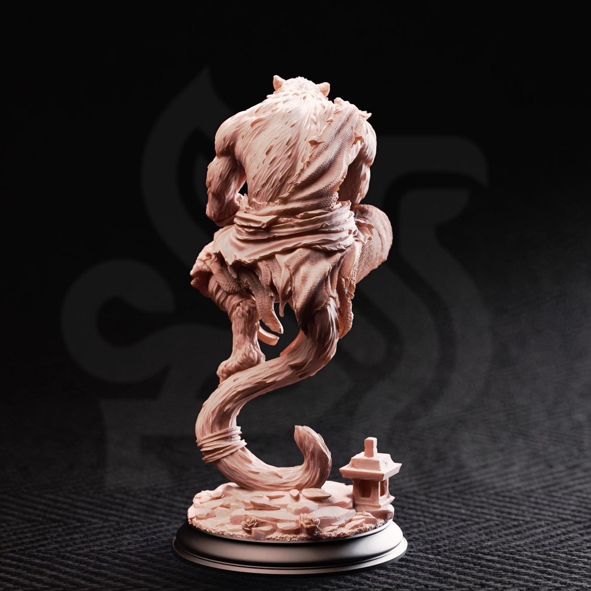 A sculpture of a fantastical creature with a long, curved tail and a small, pointed structure at the base, set against a dark background.