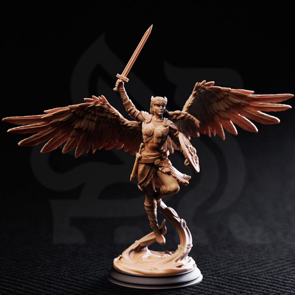 A figurine of a winged female warrior figure with a sword raised, standing on a pedestal against a dark background.