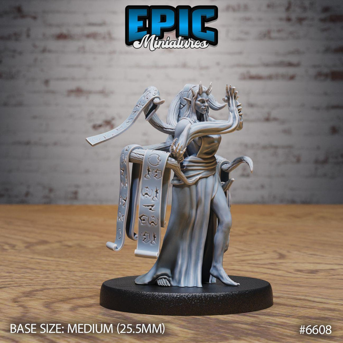 A figurine of a female character with horns and a long skirt, standing on a black base. The figurine appears to be made of a material that resembles metal or plastic. The background is a brick wall.
