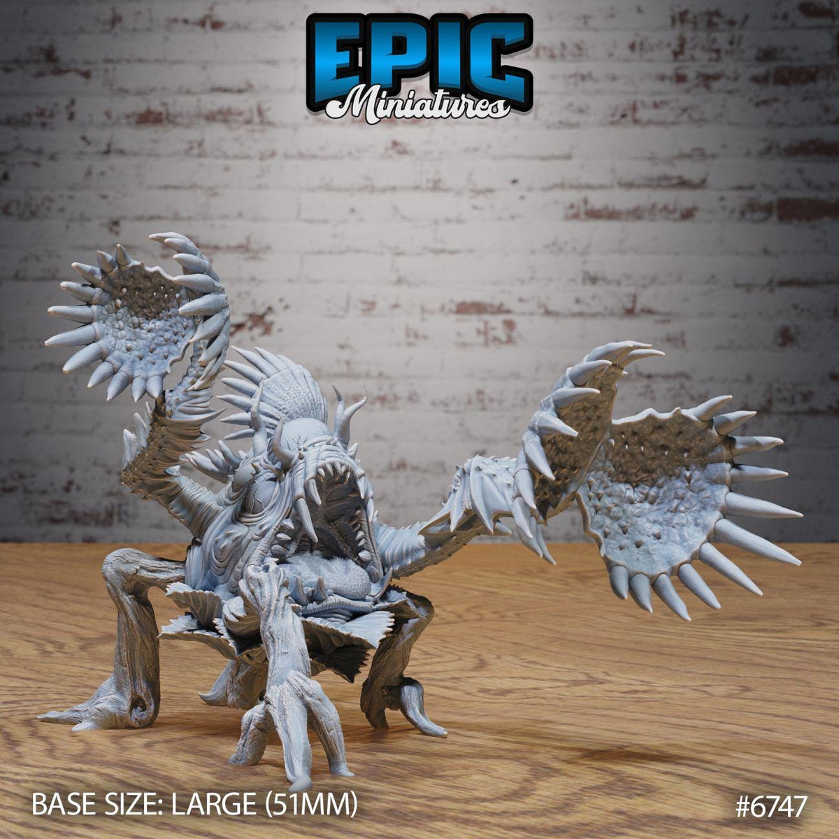 A large figurine of a monster-like creature with sharp teeth and claws, sitting on a wooden surface against a brick wall background.