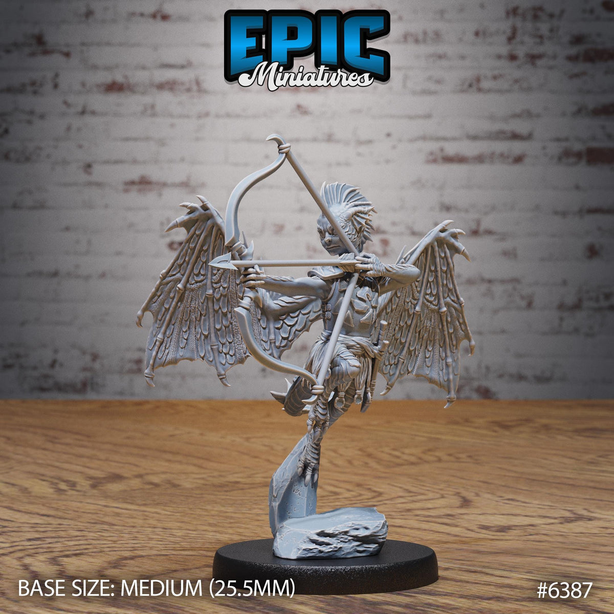 A figurine of a winged, winged creature holding a bow and arrow, standing on a black base.