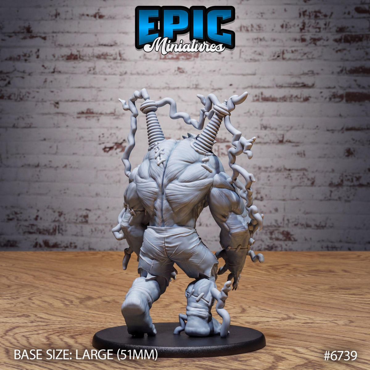 A 3D model of a large, muscular, and twisted figurine with a metallic appearance, displayed on a wooden surface against a brick wall background.