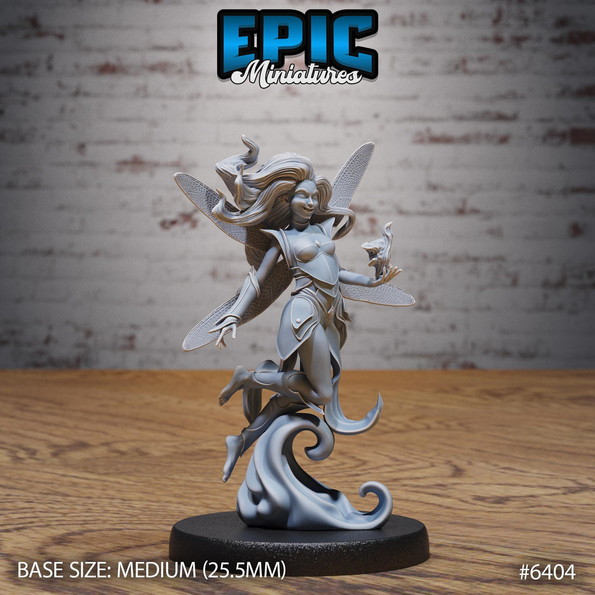 A silver figurine of a fairy-like character with wings and a flowing dress, standing on a black base.
