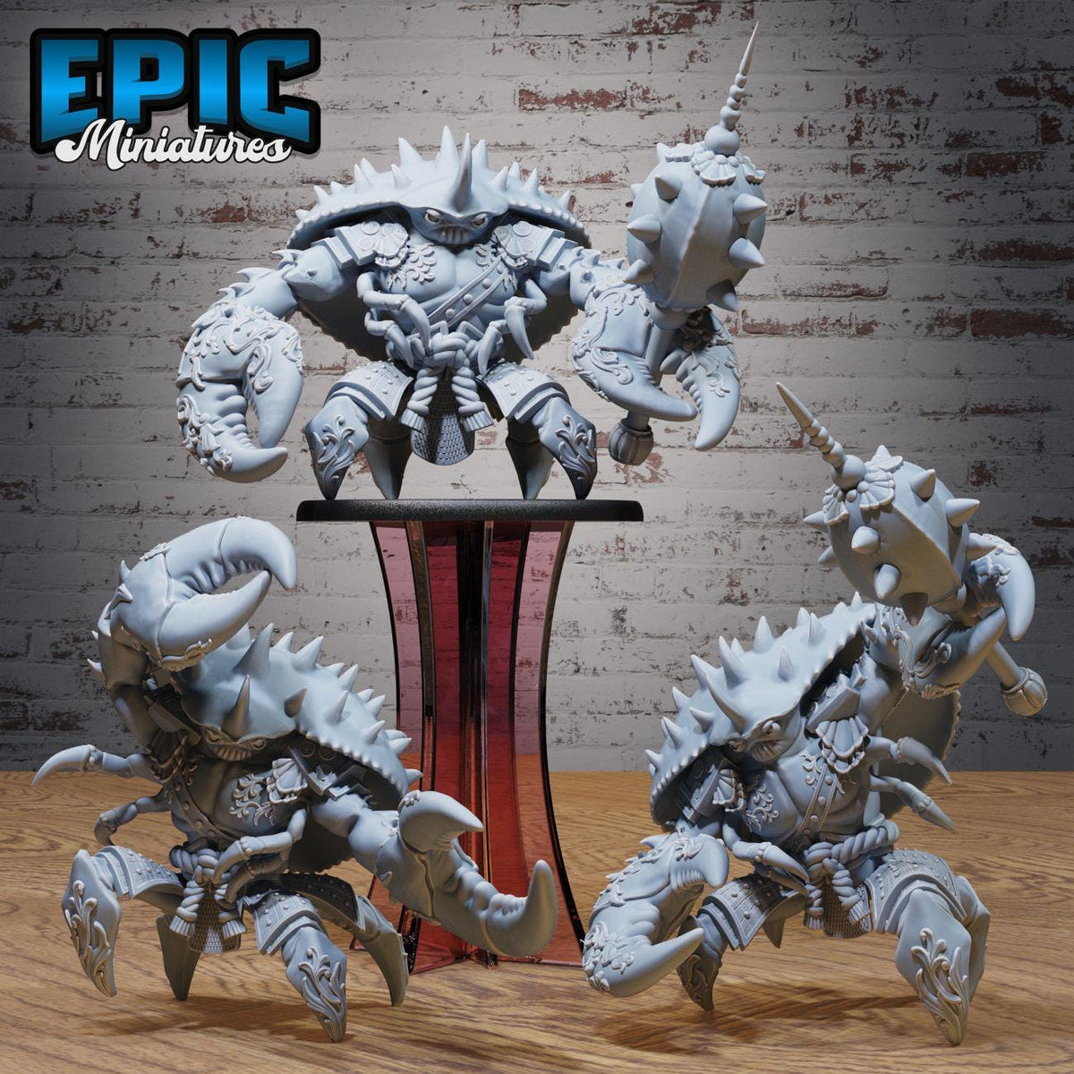 a group of detailed, miniature figurines of crabs or sea creatures with spiky shells and claws, displayed on a wooden surface against a brick wall background.