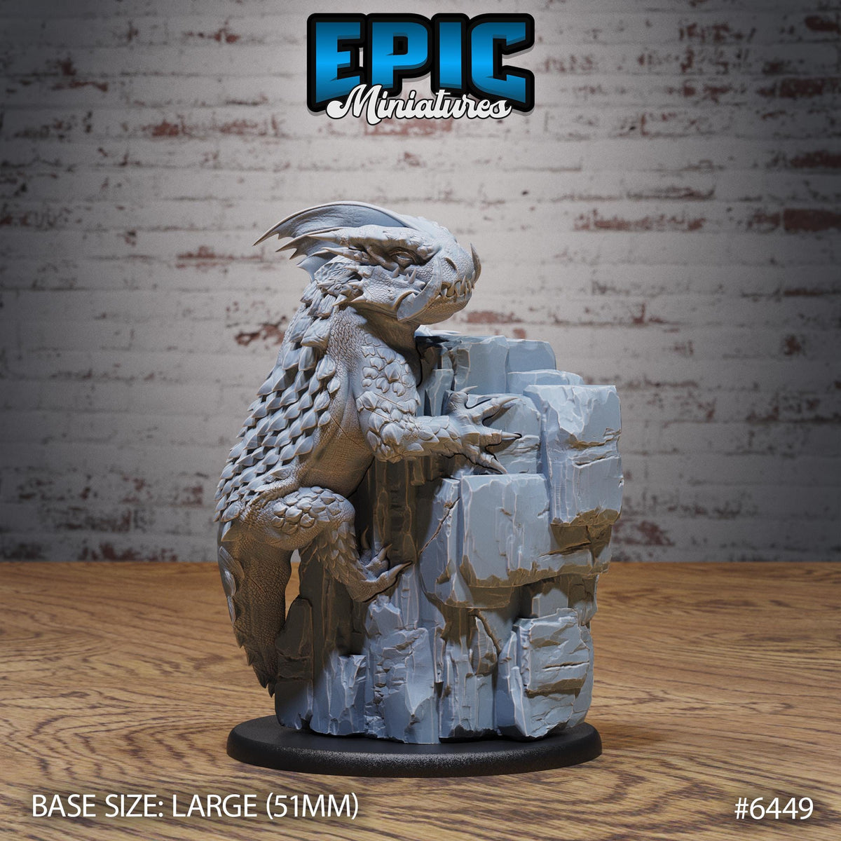 A large gray dragon figurine is displayed on a rock formation against a brick wall background.